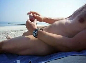 Cumming on the beach